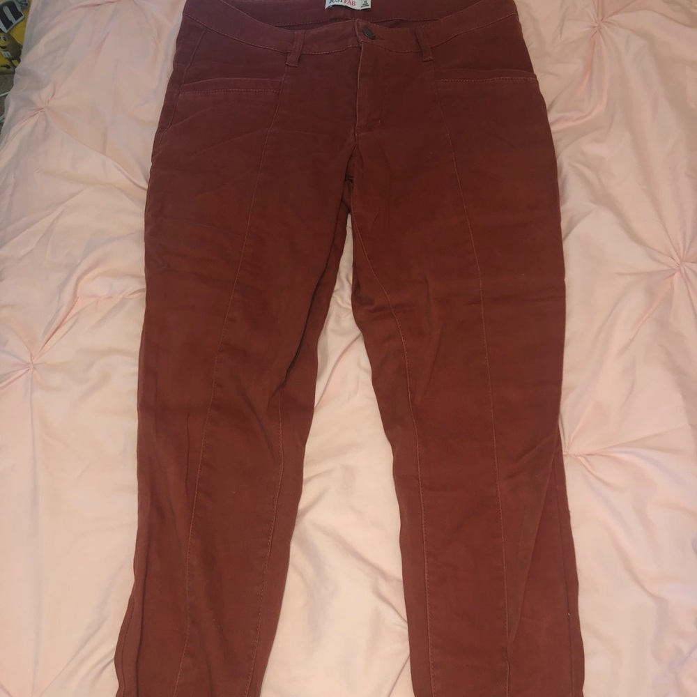 NWT. burnt orange skinny jeans with zipper